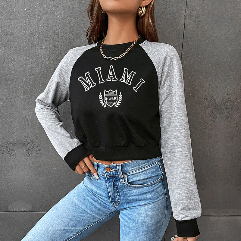 Damen Kurzgeschnittenes College-Cropped-Sweatshirt mit Raglanärmeln und elastischem Saum Shop Nory
