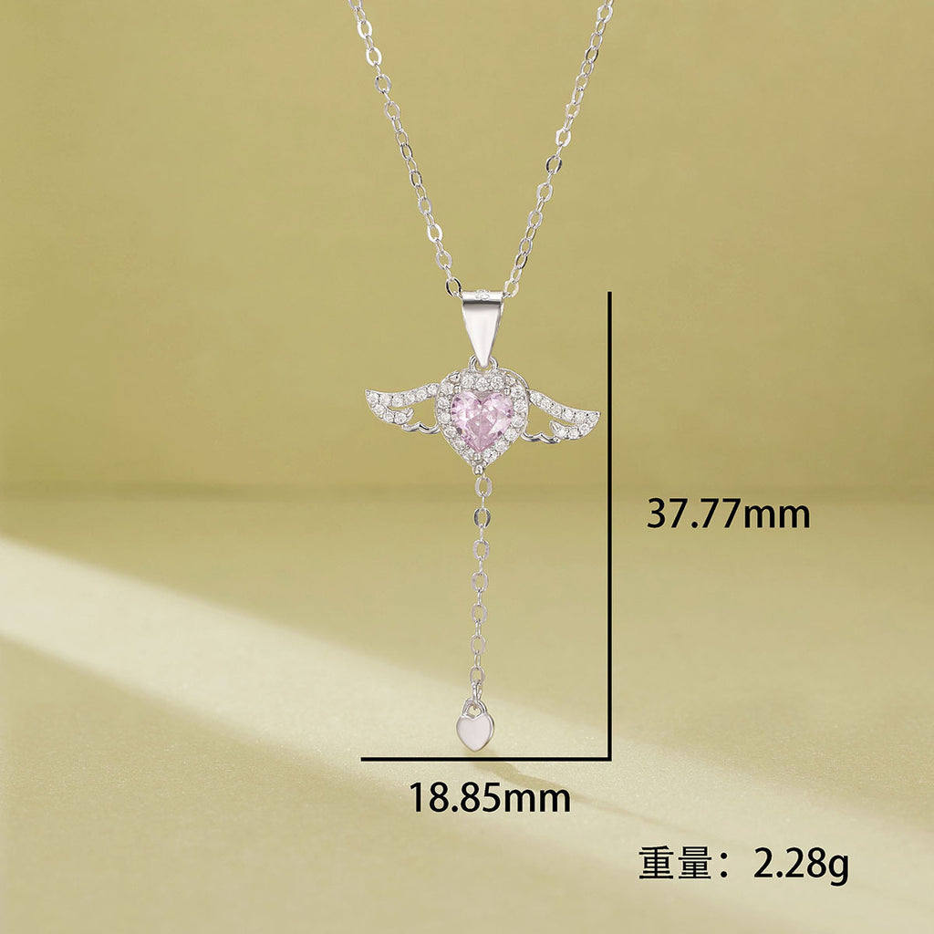 Damen Halskette mit herzförmigem Anhänger und filigranen Flügel-Details Shop Nory