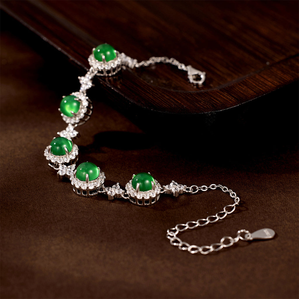 Damen Armband mit funkelnden Kristallen und grünem Edelstein Shop Nory