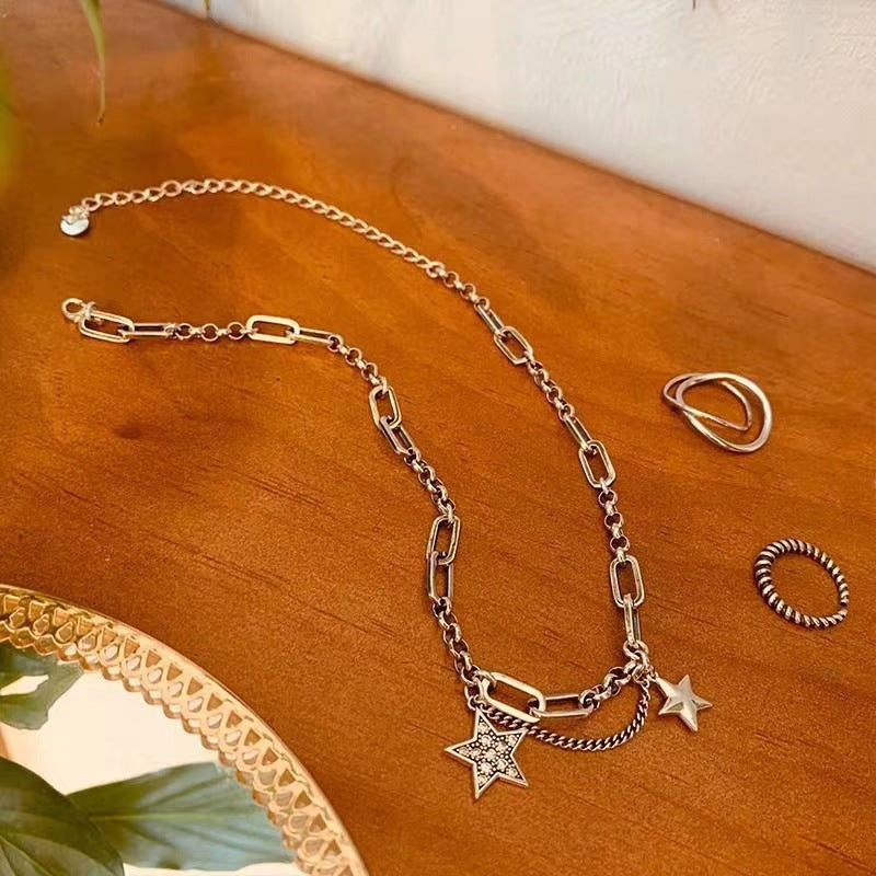 Damen Halskette mit verspielt funkelnden Sternen und modernem Gliederdesign Shop Nory