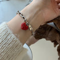 Damenarmband mit herzförmigem Anhänger und funkelnden Details Shop Nory