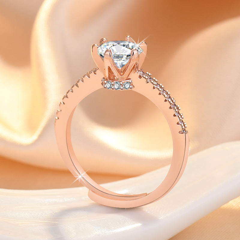 Damenring mit funkelndem Zirkonia und eleganten Goldverzierungen Shop Nory