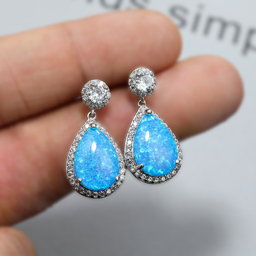 Damen Tropfenohrringe mit funkelnden Zirkonia und opalisierenden Elementen Shop Nory