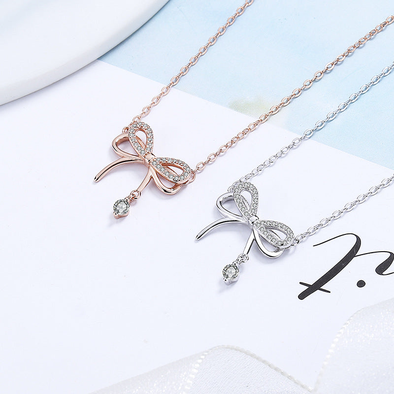 Damen Halskette mit filigranem Schleifenanhänger und funkelnden Zirkonia Shop Nory