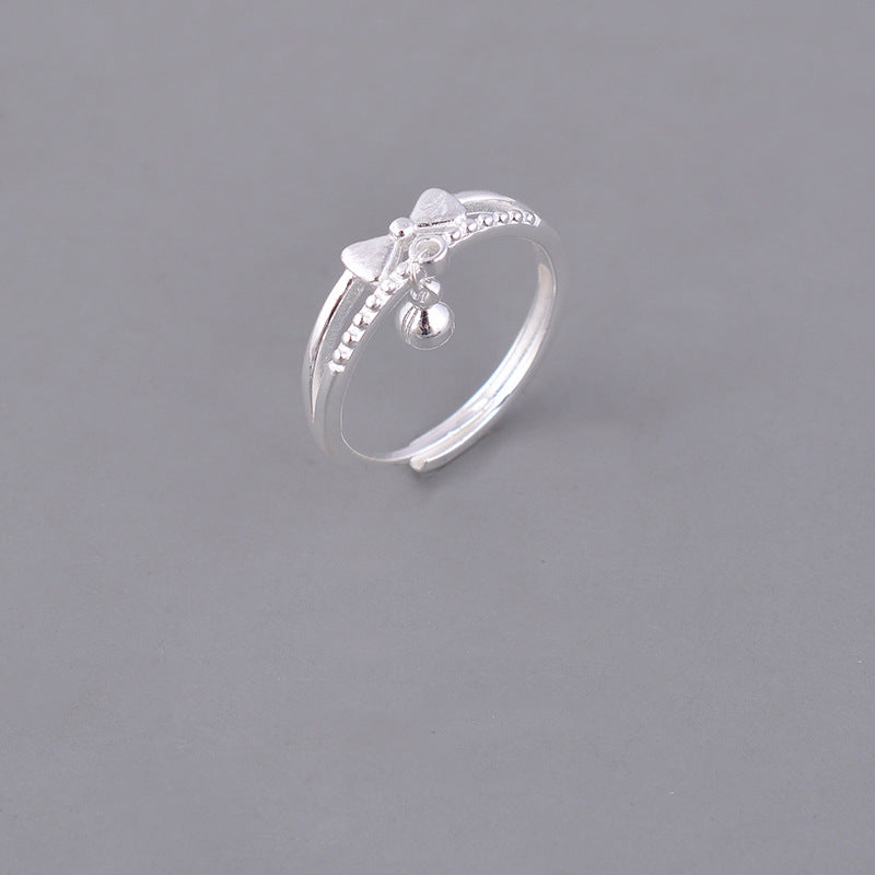 Damen filigraner Ring mit verspieltem Schleifen- und Glöckchen-Design Shop Nory