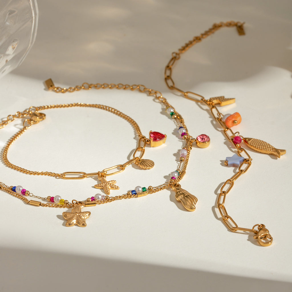 Damen Armband mit bunten Perlen und funkelndem Sternenanhänger Shop Nory