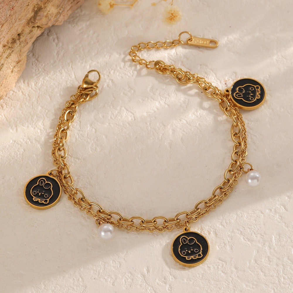 Damen Armband mit charmantem Anhänger und eleganten Perlen Shop Nory
