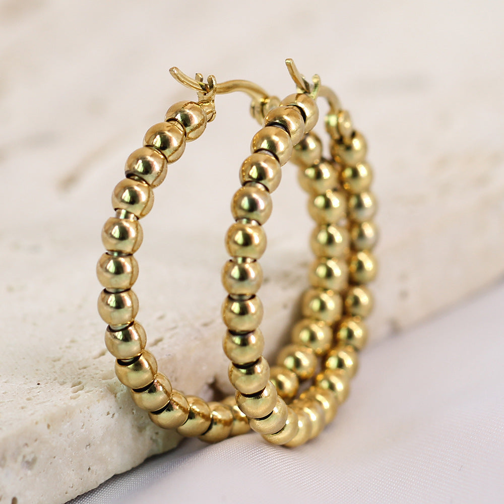Damen Creolen aus hochwertigem Edelstahl mit glänzenden Kugeldetails Shop Nory