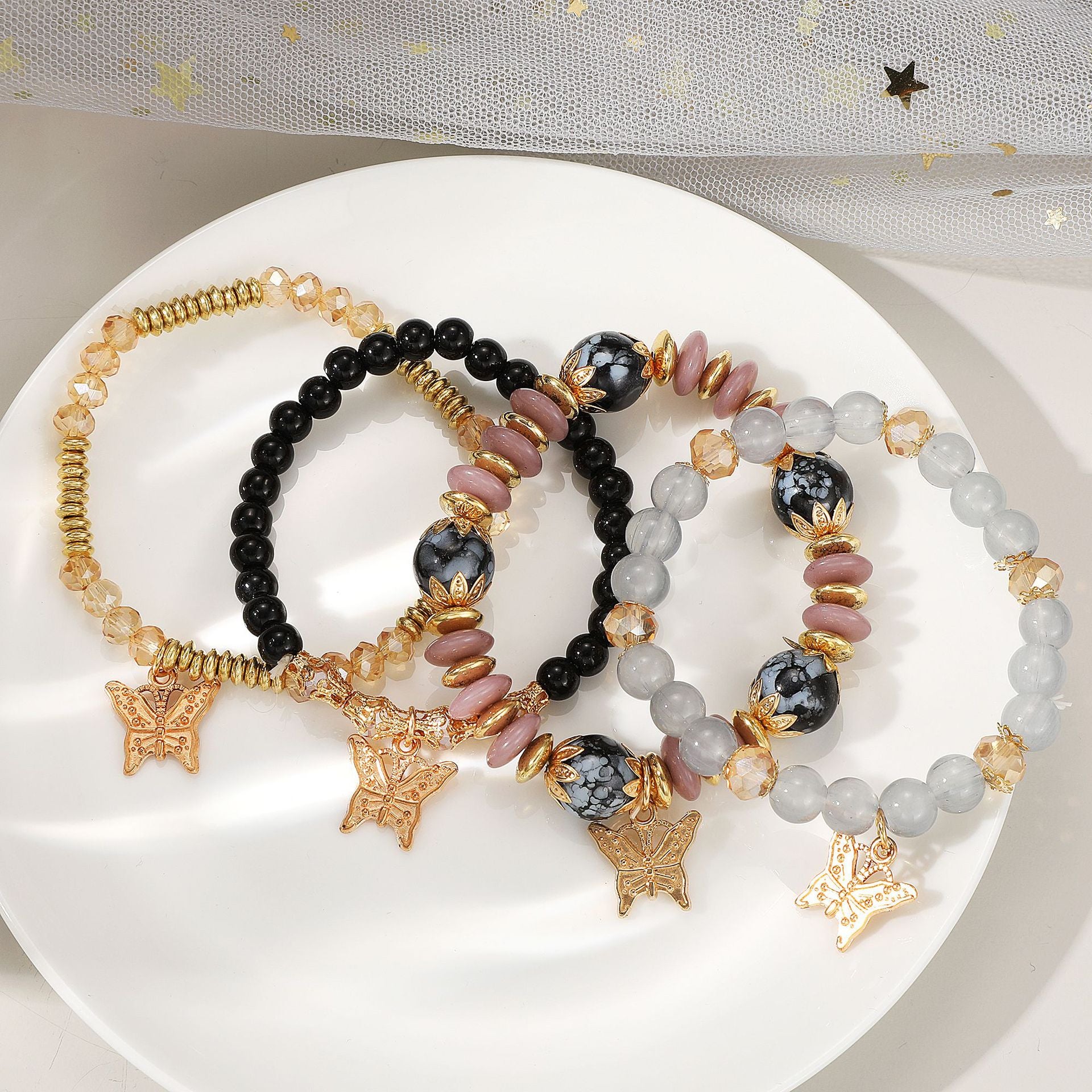 Damen Armband-Set mit filigranen Schmetterlingsanhängern und funkelnden Akzenten Shop Nory