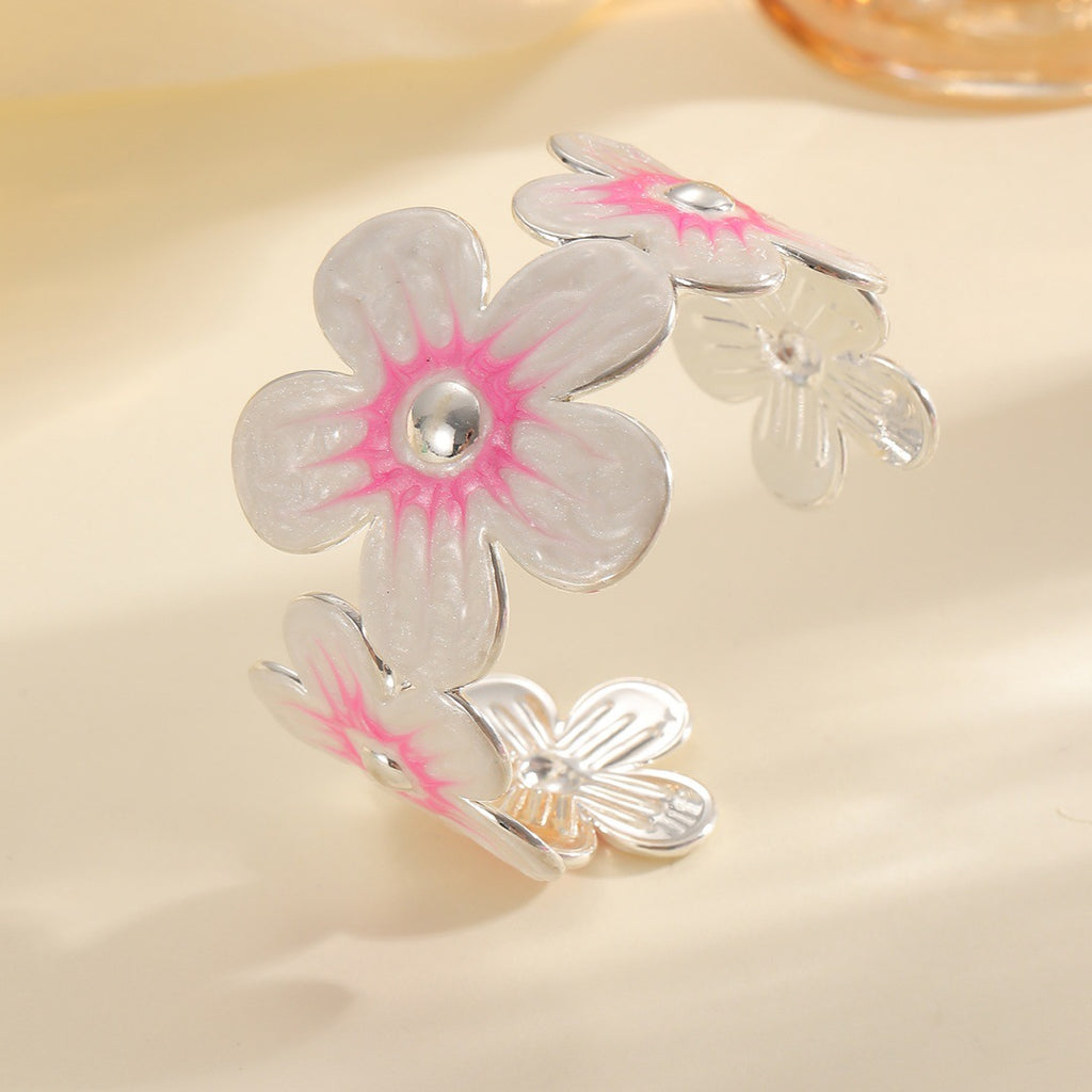 Damen Armreif aus hochwertigem Metall mit floralem Design Shop Nory