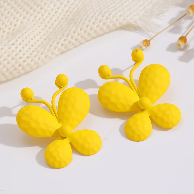 Damen Ohrclips mit kunstvollem Blumenmuster Shop Nory