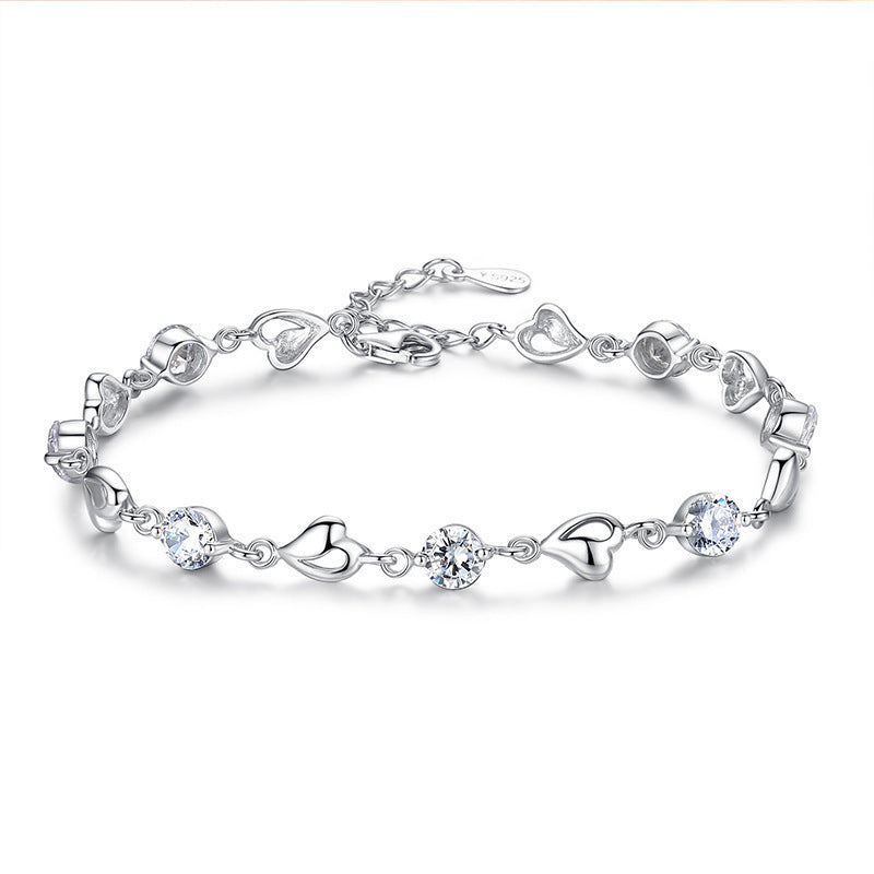 Damen Armband mit funkelnden Herz- und Zirkonia-Elementen Shop Nory