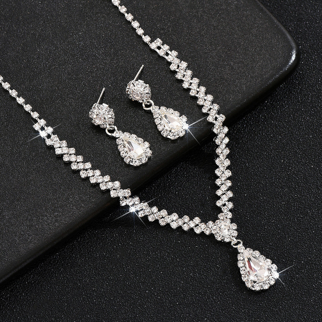 Tropfenpendant und passendes Tropfohrschmuckset für Braut mit kubischem Zirkonia-Halo