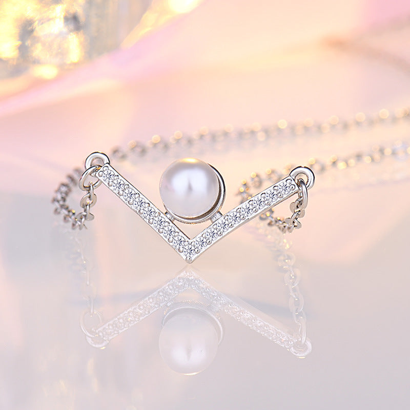 Damen Halskette aus hochwertigem Edelstahl mit eleganter Perle und funkelnden Zirkonia-Elementen Shop Nory