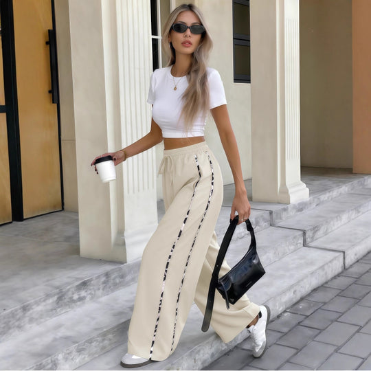 Damen Weite High‑Waist Loungehose mit Kordelzug und kontrastierenden Seitenstreifen Shop Nory