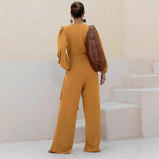 Damen Eleganter Palazzo-Jumpsuit mit tiefem V‑Ausschnitt, Bindegürtel und Ballonärmeln Shop Nory