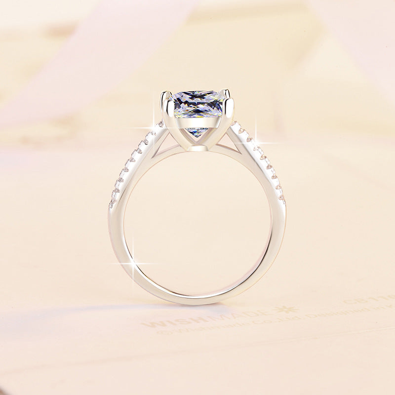 Damen Verlobungsring mit funkelndem quadratischem Zirkonia und filigranem Design Shop Nory