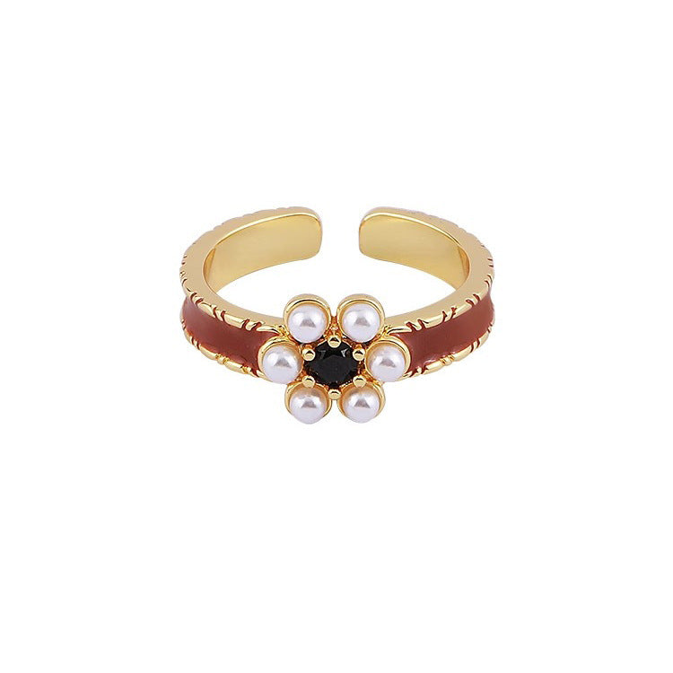 Damen Offener Armreif mit floralen Akzenten und funkelnden Perlen Shop Nory