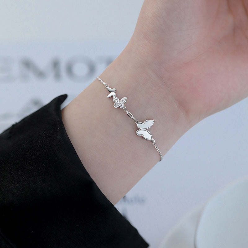 Damenarmband mit filigranem Schmetterlingsdesign und funkelnden Zirkonia Shop Nory