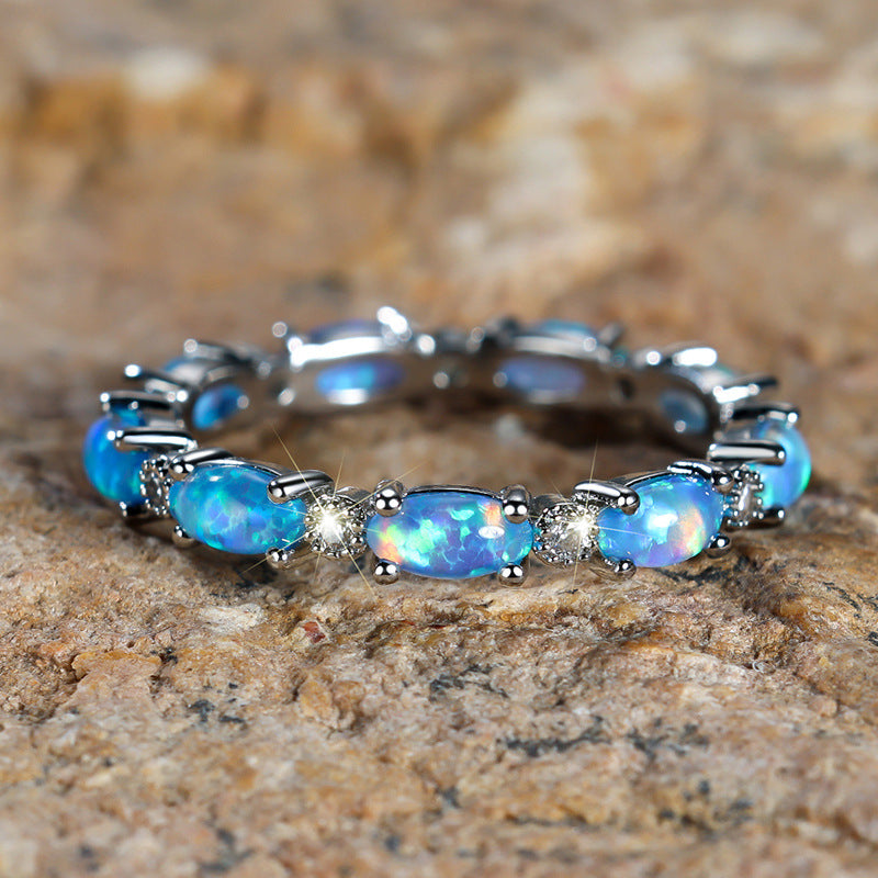 Damen Ring mit funkelnden Opalsteinen und filigranem Design Shop Nory