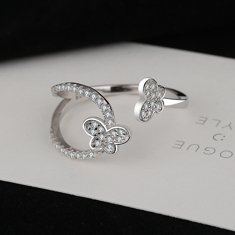 Damen Ring mit verspieltem Schmetterlingsdesign und funkelnden Zirkonia Shop Nory