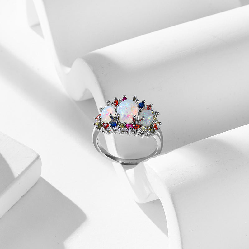 Damen eleganter Ring mit opalisierten Steinen und bunten Akzenten Shop Nory