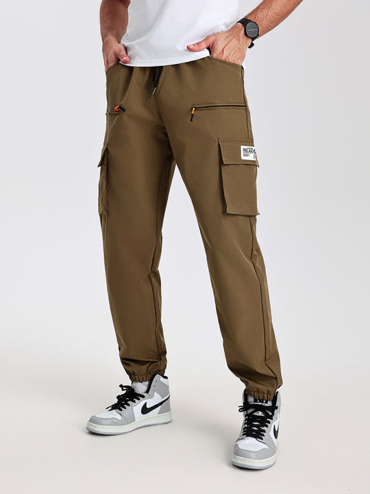 Herren konisch geschnittene Utility-Cargohose im Joggerstil mit Tunnelzugbund, Reißverschlusstaschen & elastischen Beinabschlüssen Shop Nory