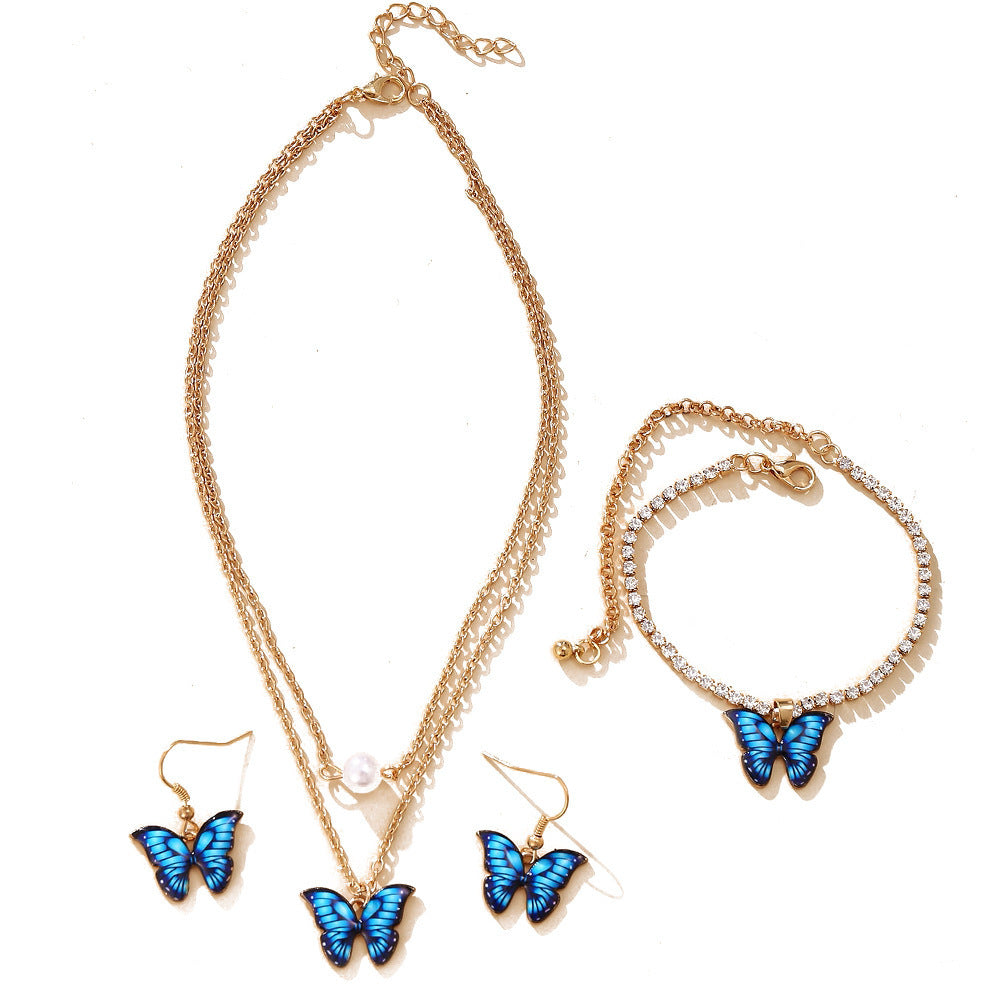 Damen Schmuckset mit schimmernden Schmetterlingsanhängern und funkelnden Elementen Shop Nory