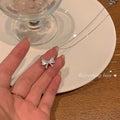 Damen Halskette mit elegantem Schleifenanhänger Shop Nory