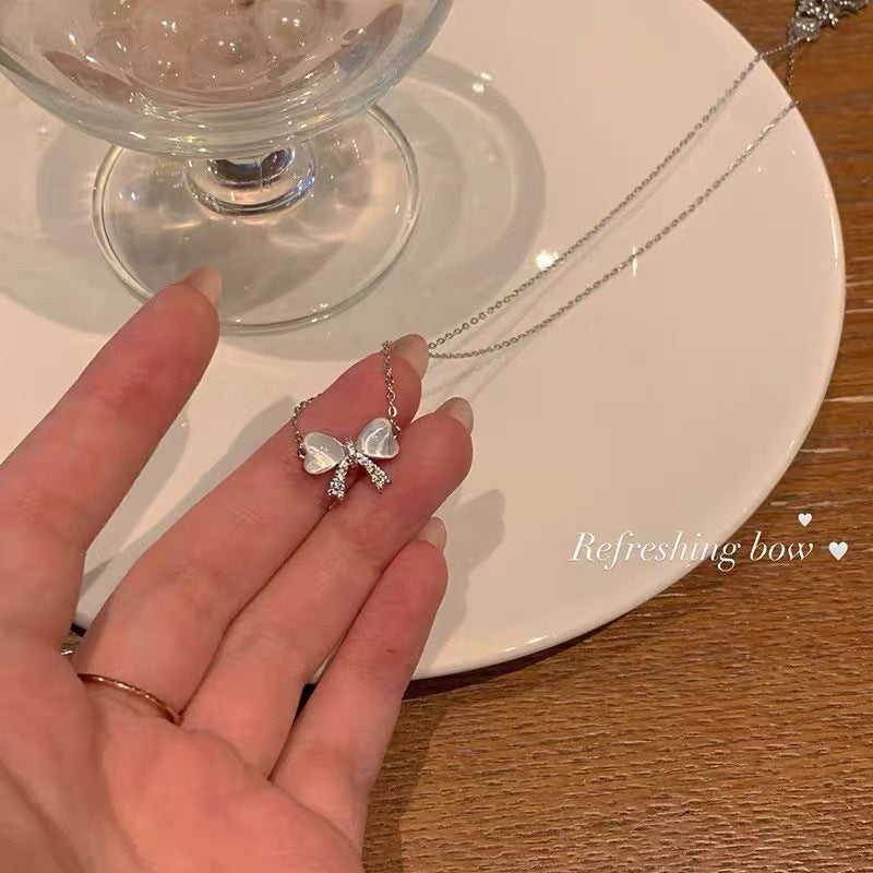 Damen Halskette mit elegantem Schleifenanhänger Shop Nory