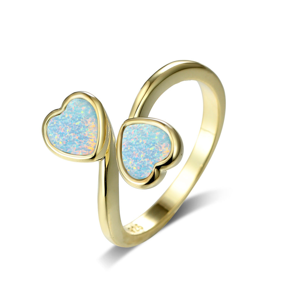 Damen Ring mit strahlendem Herzdesign und leuchtenden Opal-Effekten Shop Nory