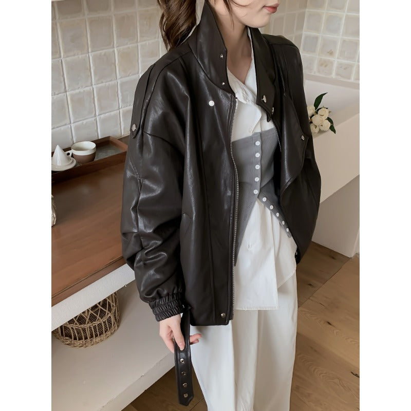 Damen Oversize Bikerjacke aus veganem Leder mit hohem Stehkragen und dekorativen Druckknöpfen Shop Nory