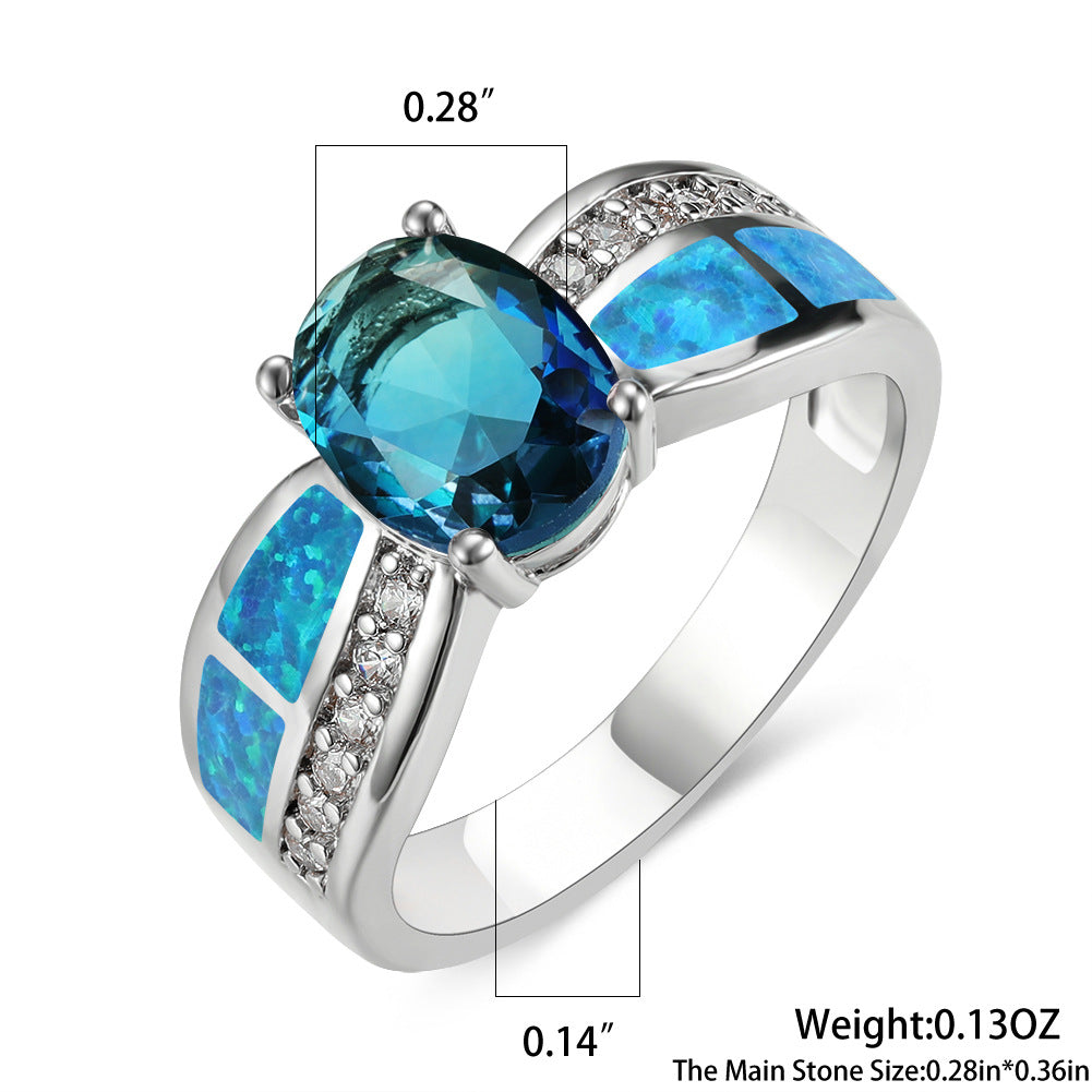 Damen Ring mit kunstvollem Opalanhänger und funkelnden Zirkonia-Details Shop Nory