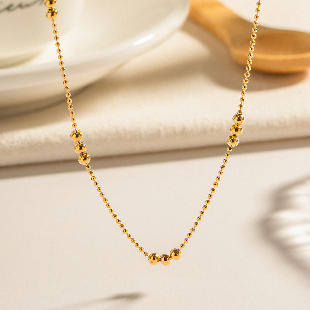 Damen Halskette mit schimmernden goldenen Kugeldetails Shop Nory