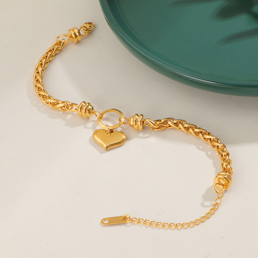 Damen liebevolles Armband mit herzförmigem Anhänger und kunstvollem Geflecht Shop Nory