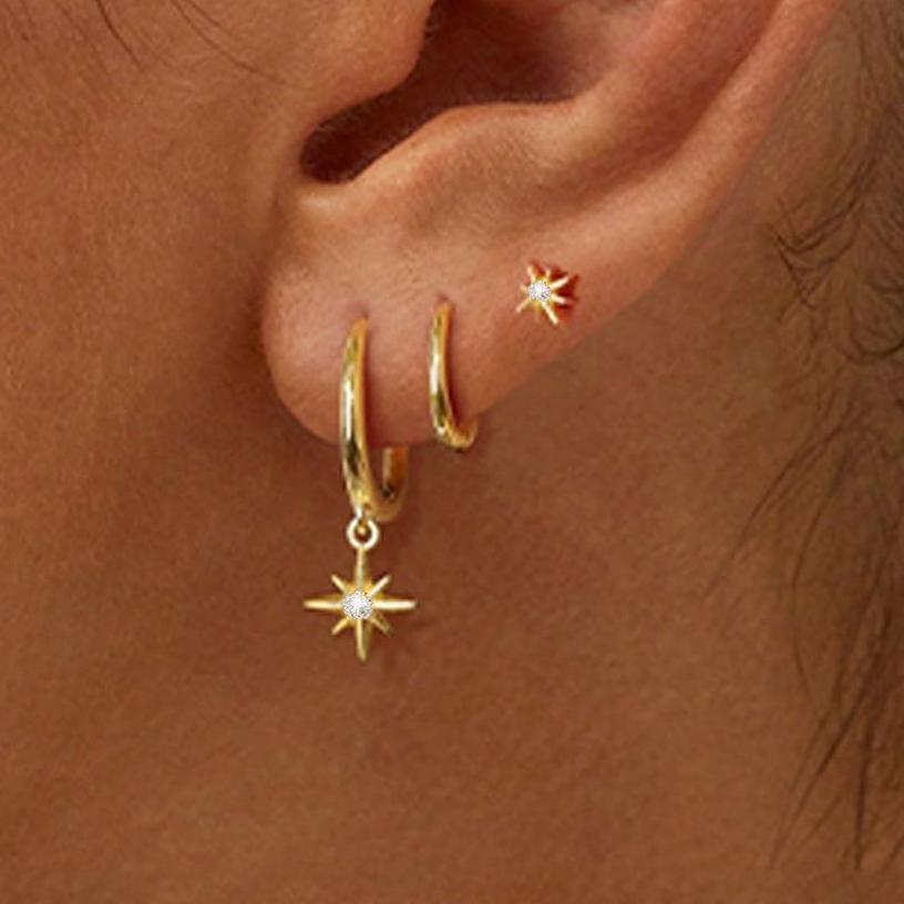Damen Ohrschmuck mit funkelndem Sternanhänger und eleganten Creolen Shop Nory