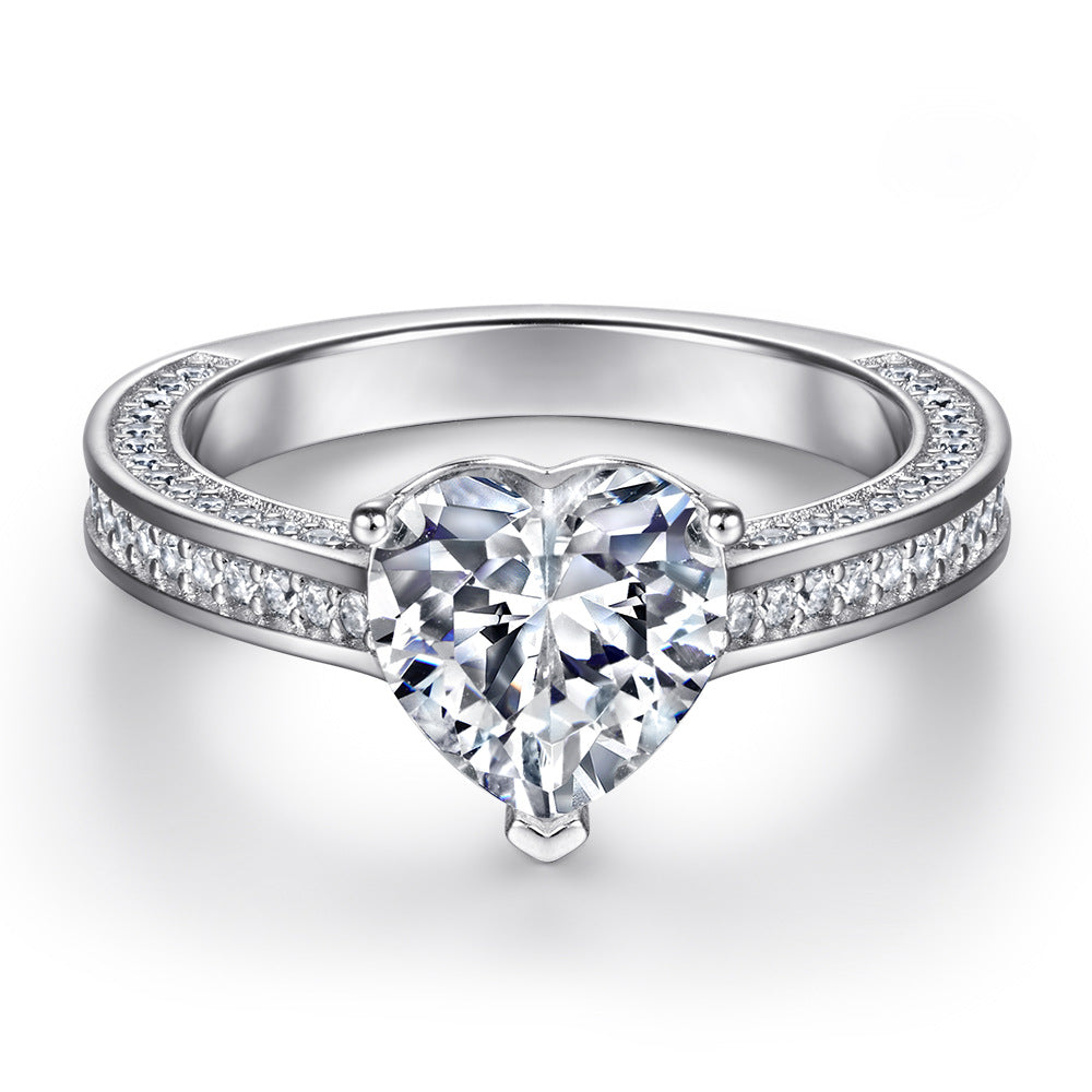 Damen Verlobungsring mit strahlendem Hauptstein und kunstvollem Zirkonia-Besatz Shop Nory