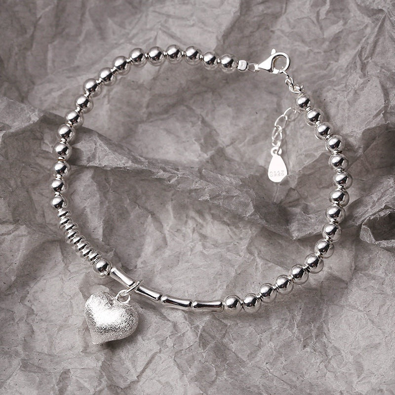 Damen Armband mit herzförmigem Anhänger Shop Nory