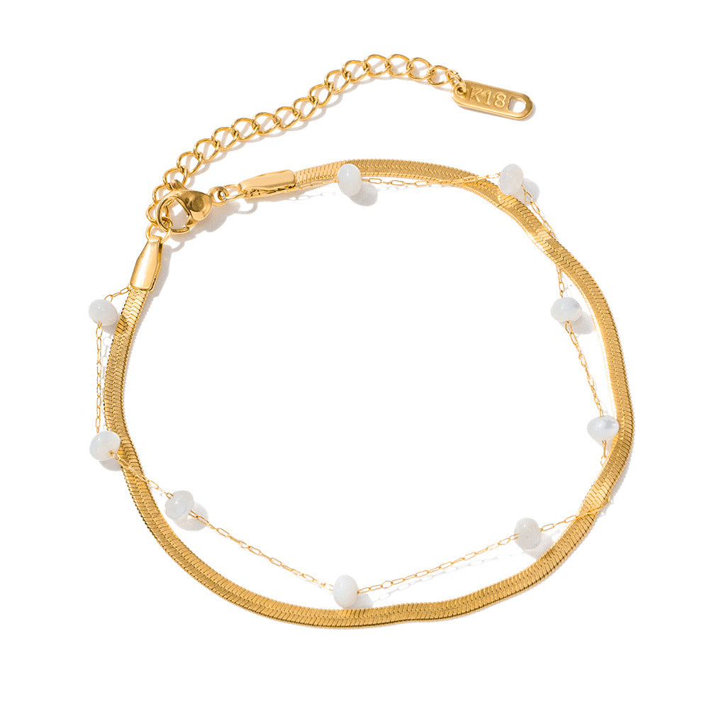 Damen Armband mit zarten Gliederketten und eleganten Perlenakzenten Shop Nory