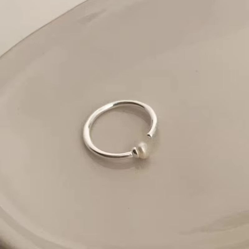 Damenring mit kunstvollem Wellen-Design und funkelnden Akzenten Shop Nory