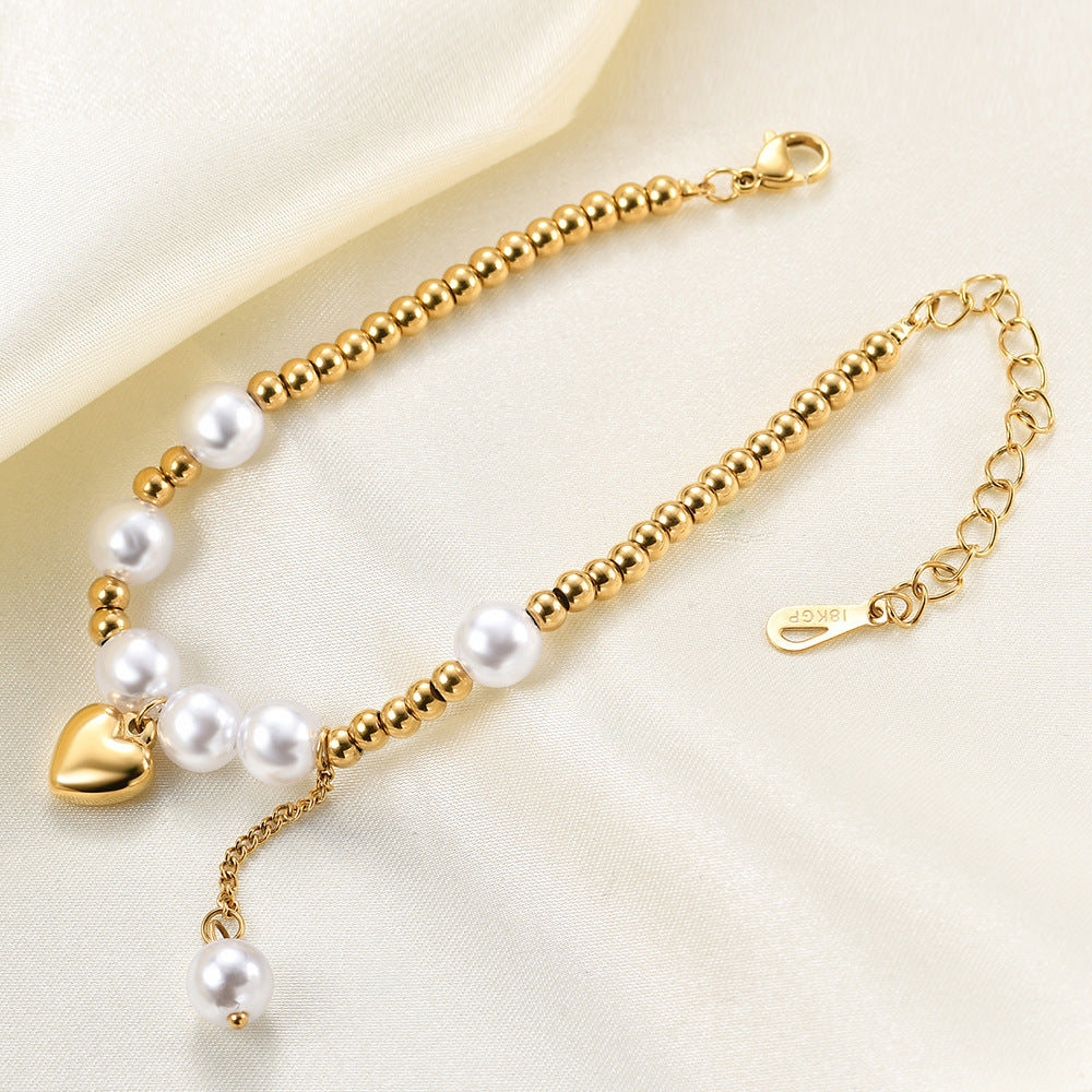 Damen Armband mit Herzanhänger und Perlenakzenten Shop Nory