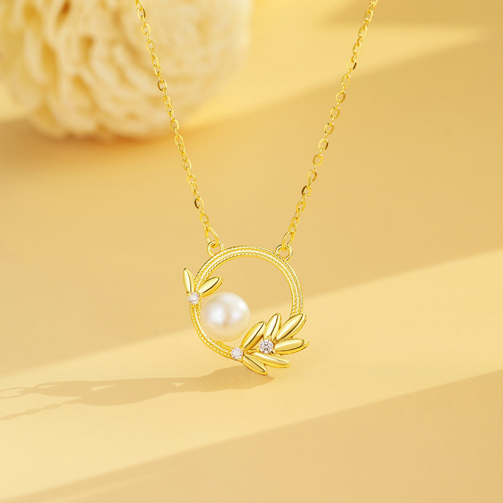 Damen Halskette mit elegantem Perlenelement und filigranem Blätter-Design Shop Nory