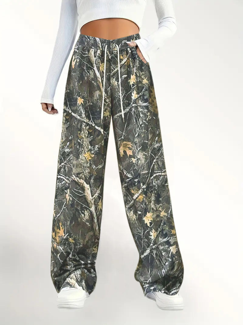 Damen Weite Palazzo-Loungehose im Camouflage-Blattmuster mit Elastikbund, Tunnelzug und Eingrifftaschen Shop Nory