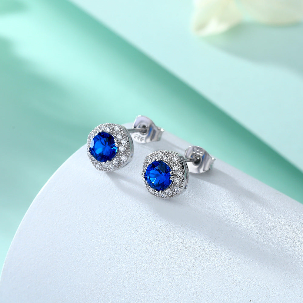Damen Ohrstecker mit facettierten blauen Kristallen und funkelndem Zirkonia-Rahmen Shop Nory