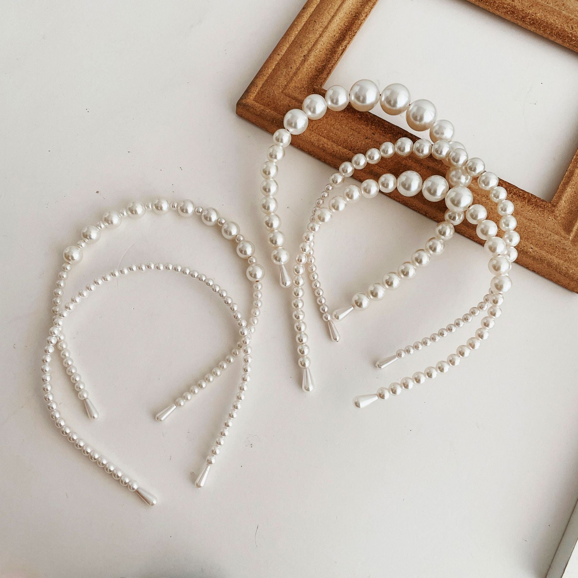 Damen Haarband mit eleganten Perlenakzenten Shop Nory