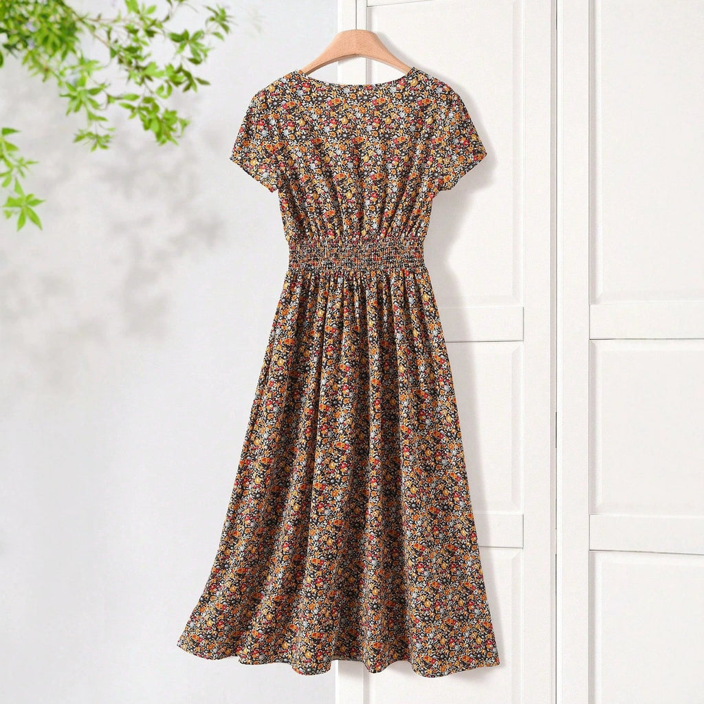 Damen Sommerliches Midikleid mit elastischem Bund und floralen Mustern
