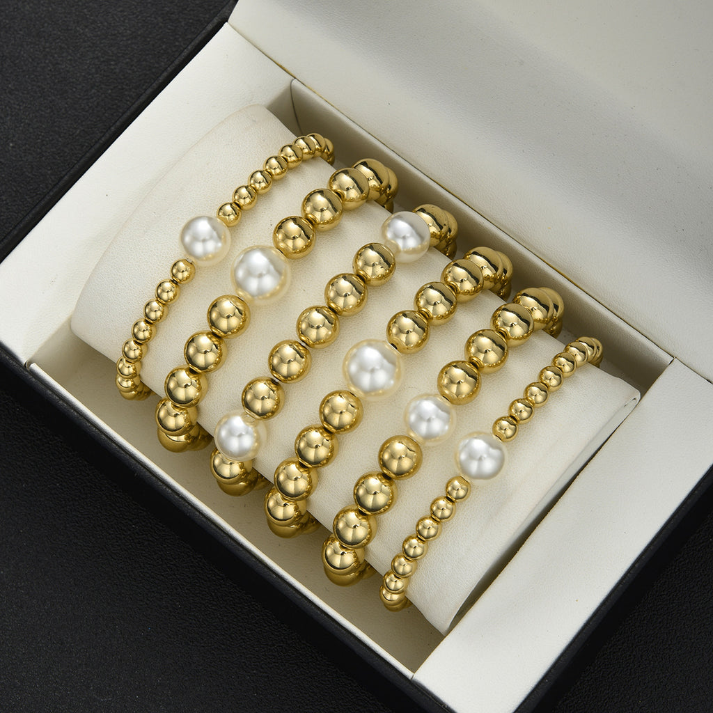 Damen Armreif-Set aus eleganten Perlen und glänzenden Goldakzenten Shop Nory