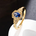 Damenring mit ovalem blauem Edelstein und funkelnden Zirkonia-Steinen Shop Nory