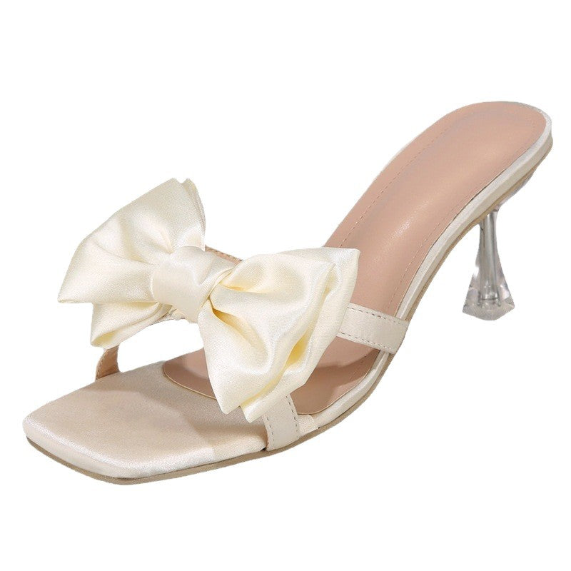 Damen High Heel Pantoletten mit eleganter Schleifen-Applikation und glitzerndem Absatz
