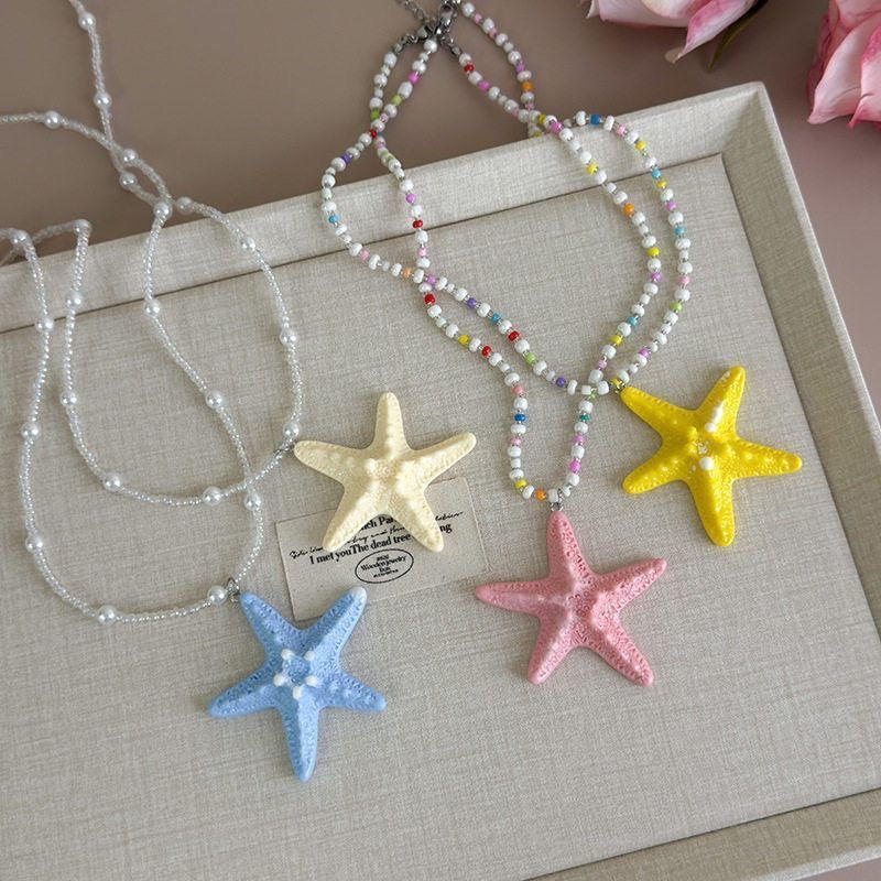 Damen Kette mit einzigartigem Sternenanhänger und buntem Perlenmuster Shop Nory